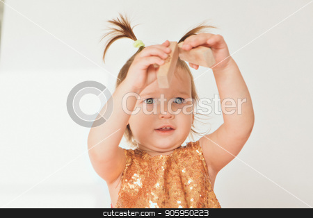 To use this stock image in your creative project, please select the size you need over to the right and click the "Add to Cart" button.
Your downloaded image will come with the Cutcaster watermark removed so don’t worry about the watermark you see on this page. portrait of a little girl with tails on white background. Baby plays with toys stock photo, portrait of a little girl with tails on white background. Baby plays with toys by aaalll3110