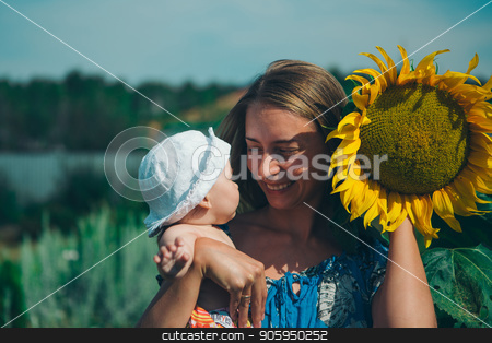To use this stock image in your creative project, please select the size you need over to the right and click the "Add to Cart" button.
Your downloaded image will come with the Cutcaster watermark removed so don’t worry about the watermark you see on this page. Portrait of a girl with baby and flower on a background of green foliage stock photo, Portrait of a girl with baby and flower on a background of green foliage by aaalll3110