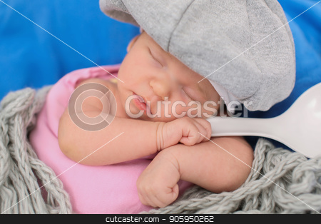 To use this stock image in your creative project, please select the size you need over to the right and click the "Add to Cart" button.
Your downloaded image will come with the Cutcaster watermark removed so don’t worry about the watermark you see on this page. A little child in a grey cap lies witn a spoon on a blue background stock photo, A little child in a grey cap lies witn a spoon on a blue background by aaalll3110