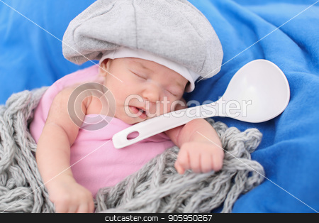 To use this stock image in your creative project, please select the size you need over to the right and click the "Add to Cart" button.
Your downloaded image will come with the Cutcaster watermark removed so don’t worry about the watermark you see on this page. A little child in a grey cap lies witn a spoon on a blue background stock photo, A little child in a grey cap lies witn a spoon on a blue background by aaalll3110