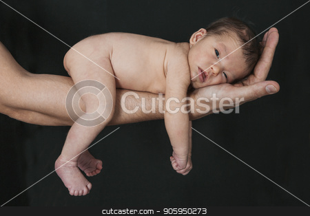To use this stock image in your creative project, please select the size you need over to the right and click the "Add to Cart" button.
Your downloaded image will come with the Cutcaster watermark removed so don’t worry about the watermark you see on this page. baby on the hands of parents on a black background. stock photo, baby on the hands of parents on a black background. by aaalll3110