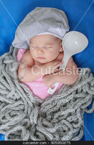 To use this stock image in your creative project, please select the size you need over to the right and click the "Add to Cart" button.
Your downloaded image will come with the Cutcaster watermark removed so don’t worry about the watermark you see on this page. A little child in a grey cap lies witn a spoon on a blue background stock photo, A little child in a grey cap lies witn a spoon on a blue background by aaalll3110