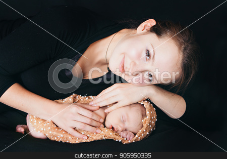 To use this stock image in your creative project, please select the size you need over to the right and click the "Add to Cart" button.
Your downloaded image will come with the Cutcaster watermark removed so don’t worry about the watermark you see on this page. A women with baby on a balck background stock photo, A women with baby on a balck background by aaalll3110