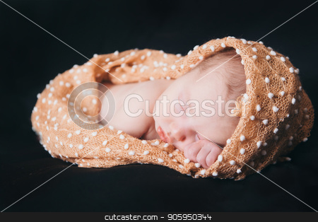 To use this stock image in your creative project, please select the size you need over to the right and click the "Add to Cart" button.
Your downloaded image will come with the Cutcaster watermark removed so don’t worry about the watermark you see on this page. newborn baby lying on a black background. Imitation of a baby in the womb. beautiful little girl sleeping lying on her tummy. stock photo, the first days of a child's life. 14 days old. 2 weeks of life by aaalll3110