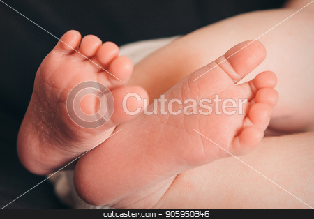 To use this stock image in your creative project, please select the size you need over to the right and click the "Add to Cart" button.
Your downloaded image will come with the Cutcaster watermark removed so don’t worry about the watermark you see on this page. baby feet close up on black background stock photo, baby feet close up on black background by aaalll3110