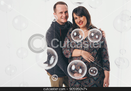 To use this stock image in your creative project, please select the size you need over to the right and click the "Add to Cart" button.
Your downloaded image will come with the Cutcaster watermark removed so don’t worry about the watermark you see on this page. Family portrait: the husband embraces the pregnant wife on a white background. pregnant couple in love stock photo, Family portrait: the husband embraces the pregnant wife on a white background. pregnant couple in love by aaalll3110