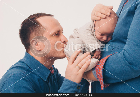 To use this stock image in your creative project, please select the size you need over to the right and click the "Add to Cart" button.
Your downloaded image will come with the Cutcaster watermark removed so don’t worry about the watermark you see on this page. a man kisses a newborn child, who lies in the hands of a woman. Family portrait: isolated photo stock photo, a man kisses a newborn child, who lies in the hands of a woman. Family portrait: isolated photo by aaalll3110