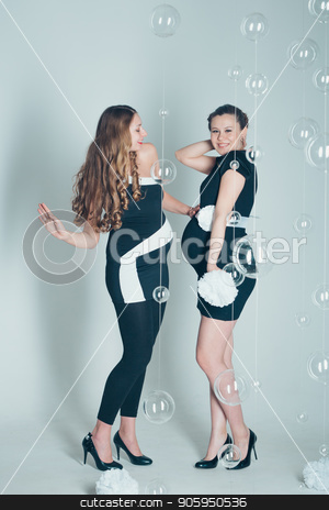 To use this stock image in your creative project, please select the size you need over to the right and click the "Add to Cart" button.
Your downloaded image will come with the Cutcaster watermark removed so don’t worry about the watermark you see on this page. two pregnant women in black and white dresses on white background. Fashion for pregnants stock photo, two pregnant women in black and white dresses on white background. Fashion for pregnants by aaalll3110