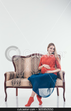 To use this stock image in your creative project, please select the size you need over to the right and click the "Add to Cart" button.
Your downloaded image will come with the Cutcaster watermark removed so don’t worry about the watermark you see on this page. Pregnant woman sitting on the couch in a white background stock photo, Pregnant woman sitting on the couch in a white background by aaalll3110