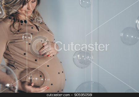 To use this stock image in your creative project, please select the size you need over to the right and click the "Add to Cart" button.
Your downloaded image will come with the Cutcaster watermark removed so don’t worry about the watermark you see on this page. a pregnant woman holding hands on belly stock photo, a pregnant woman holding hands on belly by aaalll3110