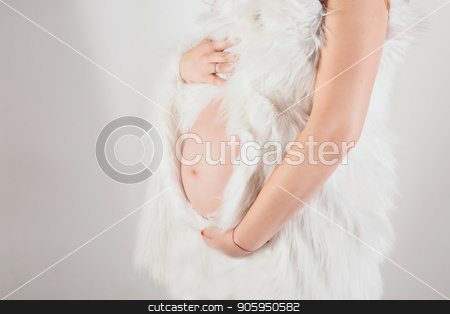 To use this stock image in your creative project, please select the size you need over to the right and click the "Add to Cart" button.
Your downloaded image will come with the Cutcaster watermark removed so don’t worry about the watermark you see on this page. pregnant woman holding hands on belly on a white background stock photo, pregnant woman holding hands on belly on a white background by aaalll3110