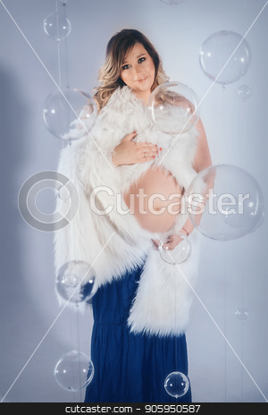 To use this stock image in your creative project, please select the size you need over to the right and click the "Add to Cart" button.
Your downloaded image will come with the Cutcaster watermark removed so don’t worry about the watermark you see on this page. a pregnant woman holding hands on belly stock photo, a pregnant woman holding hands on belly by aaalll3110