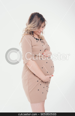 To use this stock image in your creative project, please select the size you need over to the right and click the "Add to Cart" button.
Your downloaded image will come with the Cutcaster watermark removed so don’t worry about the watermark you see on this page. pregnant woman holding hands on belly on a white background stock photo, pregnant woman holding hands on belly on a white background by aaalll3110