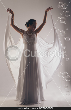 To use this stock image in your creative project, please select the size you need over to the right and click the "Add to Cart" button.
Your downloaded image will come with the Cutcaster watermark removed so don’t worry about the watermark you see on this page. girl in white and with raised hands, attached to the floor dresses. the bride in a dress in Greek style. brunette in pearl jewelry lowered her head. The woman looks like a bird or a bat stock photo, girl in white and with raised hands, attached to the floor dresses. the bride in a dress in Greek style. brunette in pearl jewelry lowered her head. The woman looks like a bird or a bat by aaalll3110