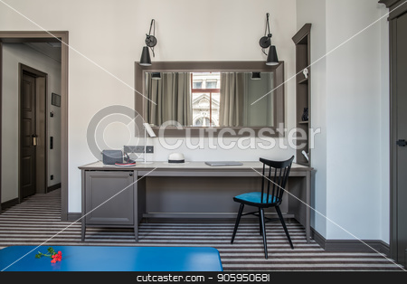 To use this stock image in your creative project, please select the size you need over to the right and click the "Add to Cart" button.
Your downloaded image will come with the Cutcaster watermark removed so don’t worry about the watermark you see on this page. Stylish hotel room stock photo, Contemporary hotel room with light walls and a striped floor. There is a blue table, wide table with a chair, different lamps, mirror on the wall, shelves with decorations, doors. Horizontal. by bezikus