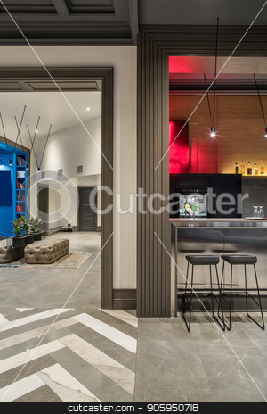 To use this stock image in your creative project, please select the size you need over to the right and click the "Add to Cart" button.
Your downloaded image will come with the Cutcaster watermark removed so don’t worry about the watermark you see on this page. Stylish interior in hotel stock photo, Modern hallway and a bar in a hotel with light walls and a tiled floor. There is a glossy bar rack with black chairs, sofas, stand with plants in the pots, doors, luminous lamps. Vertical. by bezikus