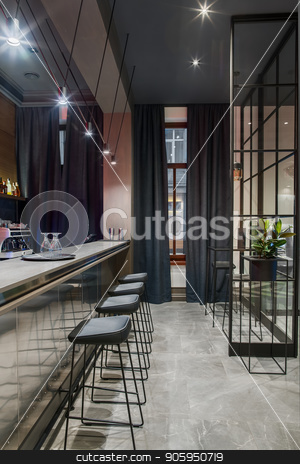 To use this stock image in your creative project, please select the size you need over to the right and click the "Add to Cart" button.
Your downloaded image will come with the Cutcaster watermark removed so don’t worry about the watermark you see on this page. Stylish bar in hotel stock photo, Bar in the hotel with light walls and a gray tiled floor. There is a glossy bar rack with black chairs, small tables, shelf with drinks, coffee machine, green plant, window, luminous lamps. Vertical. by bezikus
