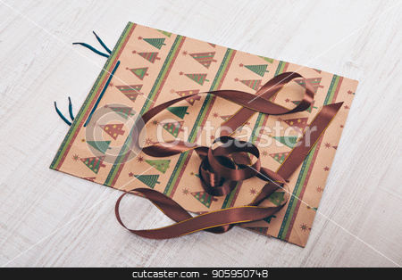 To use this stock image in your creative project, please select the size you need over to the right and click the "Add to Cart" button.
Your downloaded image will come with the Cutcaster watermark removed so don’t worry about the watermark you see on this page. gift bag with Christmas tree pattern on white background stock photo, gift bag with Christmas tree pattern on white background by aaalll3110