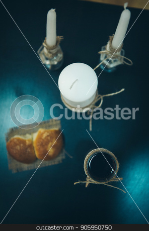 To use this stock image in your creative project, please select the size you need over to the right and click the "Add to Cart" button.
Your downloaded image will come with the Cutcaster watermark removed so don’t worry about the watermark you see on this page. Religious rite: communion. candles, wine, bread. Top view stock photo, Religious rite: communion. candles, wine, bread. Top view by aaalll3110