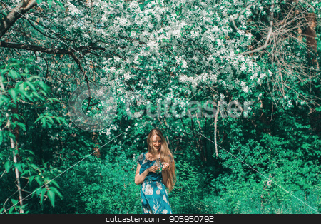 To use this stock image in your creative project, please select the size you need over to the right and click the "Add to Cart" button.
Your downloaded image will come with the Cutcaster watermark removed so don’t worry about the watermark you see on this page. young woman in forest on a background of green foliage stock photo, young woman in forest on a background of green foliage by aaalll3110