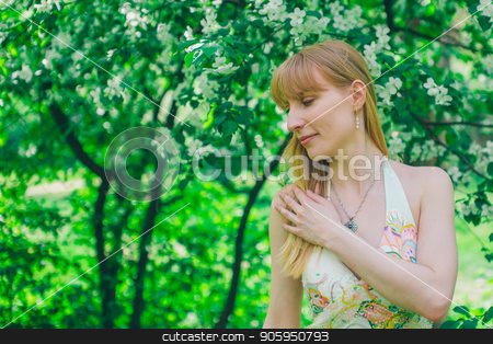 To use this stock image in your creative project, please select the size you need over to the right and click the "Add to Cart" button.
Your downloaded image will come with the Cutcaster watermark removed so don’t worry about the watermark you see on this page. Portrait of a girl on a background of green foliage stock photo, Portrait of a girl on a background of green foliage by aaalll3110
