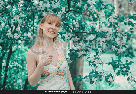 To use this stock image in your creative project, please select the size you need over to the right and click the "Add to Cart" button.
Your downloaded image will come with the Cutcaster watermark removed so don’t worry about the watermark you see on this page. Portrait of a girl on a background of green foliage stock photo, Portrait of a girl on a background of green foliage by aaalll3110