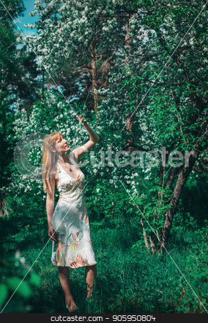 To use this stock image in your creative project, please select the size you need over to the right and click the "Add to Cart" button.
Your downloaded image will come with the Cutcaster watermark removed so don’t worry about the watermark you see on this page. young woman in forest on a background of green foliage. Fashion for women stock photo, young woman in forest on a background of green foliage. Fashion for women by aaalll3110