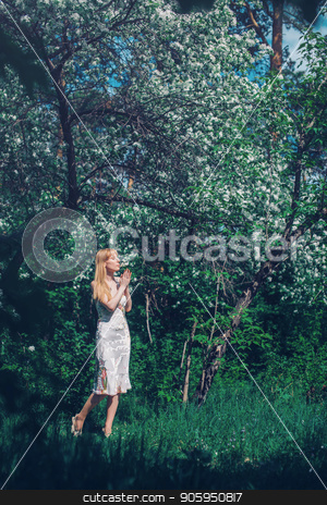 To use this stock image in your creative project, please select the size you need over to the right and click the "Add to Cart" button.
Your downloaded image will come with the Cutcaster watermark removed so don’t worry about the watermark you see on this page. young woman in forest on a background of green foliage stock photo, young woman in forest on a background of green foliage by aaalll3110