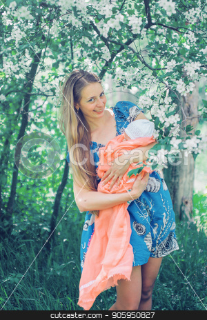 To use this stock image in your creative project, please select the size you need over to the right and click the "Add to Cart" button.
Your downloaded image will come with the Cutcaster watermark removed so don’t worry about the watermark you see on this page. Portrait of a girl with baby on a background of green foliage stock photo, Portrait of a girl with baby on a background of green foliage by aaalll3110