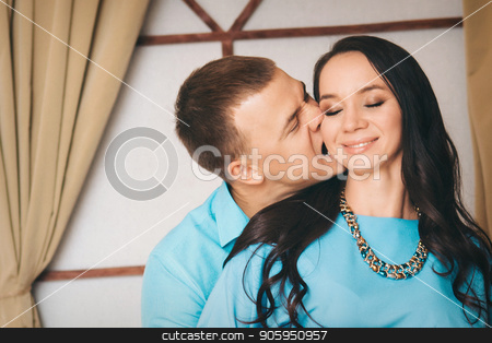 To use this stock image in your creative project, please select the size you need over to the right and click the "Add to Cart" button.
Your downloaded image will come with the Cutcaster watermark removed so don’t worry about the watermark you see on this page. family portrait: a man bites a woman by the ear. stock photo, family portrait: a man bites a woman by the ear. by aaalll3110