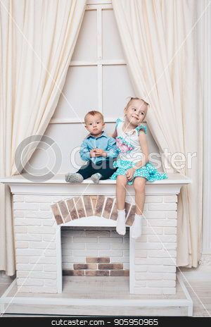 To use this stock image in your creative project, please select the size you need over to the right and click the "Add to Cart" button.
Your downloaded image will come with the Cutcaster watermark removed so don’t worry about the watermark you see on this page. a little girl and a guy in a dress sitting by the fireplace. Family portrait: sister and brother stock photo, a little girl and a guy in a dress sitting by the fireplace. Family portrait: sister and brother by aaalll3110