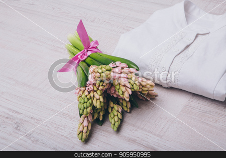 To use this stock image in your creative project, please select the size you need over to the right and click the "Add to Cart" button.
Your downloaded image will come with the Cutcaster watermark removed so don’t worry about the watermark you see on this page. rolled up white shirt and flowers close up on white background stock photo, rolled up white shirt and flowers close up on white background by aaalll3110