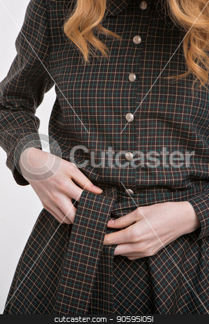 To use this stock image in your creative project, please select the size you need over to the right and click the "Add to Cart" button.
Your downloaded image will come with the Cutcaster watermark removed so don’t worry about the watermark you see on this page. girl ties a belt on a dress. Hands on fabric background close-up. Element of clothes stock photo, girl ties a belt on a dress. Hands on fabric background close-up. Element of clothes by aaalll3110