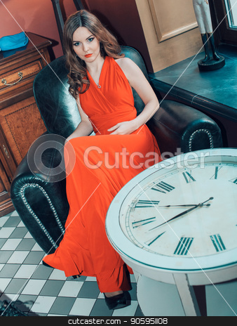 To use this stock image in your creative project, please select the size you need over to the right and click the "Add to Cart" button.
Your downloaded image will come with the Cutcaster watermark removed so don’t worry about the watermark you see on this page. beautiful girl in a long red dress sitting in a chair on the background of the clock stock photo, beautiful girl in a long red dress sitting in a chair on the background of the clock by aaalll3110