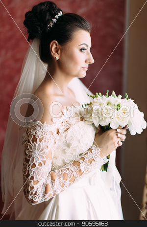 To use this stock image in your creative project, please select the size you need over to the right and click the "Add to Cart" button.
Your downloaded image will come with the Cutcaster watermark removed so don’t worry about the watermark you see on this page. Half-length side portrait of the beautiful bride holding the wedding bouquet. stock photo, Half-length side portrait of the beautiful bride holding the wedding bouquet by Andrii Kobryn