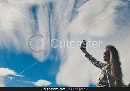 To use this stock image in your creative project, please select the size you need over to the right and click the "Add to Cart" button.
Your downloaded image will come with the Cutcaster watermark removed so don’t worry about the watermark you see on this page. silhouette of a girl talking on the phone against the clouds. Woman posing for the camera against the sky stock photo, silhouette of a girl talking on the phone against the clouds. Woman posing for the camera against the sky by aaalll3110