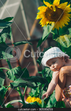 To use this stock image in your creative project, please select the size you need over to the right and click the "Add to Cart" button.
Your downloaded image will come with the Cutcaster watermark removed so don’t worry about the watermark you see on this page. Portrait of a girl and baby with flower on a background of green foliage stock photo, Portrait of a girl and baby with flower on a background of green foliage by aaalll3110