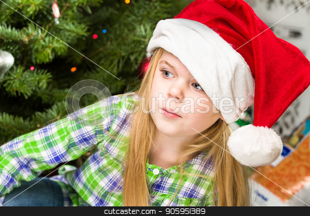 To use this stock image in your creative project, please select the size you need over to the right and click the "Add to Cart" button.
Your downloaded image will come with the Cutcaster watermark removed so don’t worry about the watermark you see on this page. portrait of a young girl during christmas day stock photo, Girl just sitting there during christmas relaxing in front of the tree and her presents. by txking