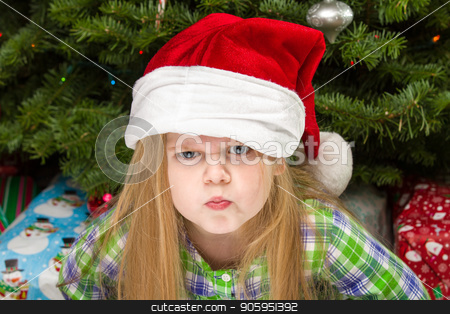 To use this stock image in your creative project, please select the size you need over to the right and click the "Add to Cart" button.
Your downloaded image will come with the Cutcaster watermark removed so don’t worry about the watermark you see on this page. The dirty look at christmas stock photo, Young child giving a dirty look during christmas time. by txking
