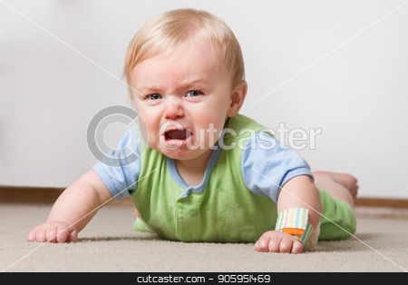 To use this stock image in your creative project, please select the size you need over to the right and click the "Add to Cart" button.
Your downloaded image will come with the Cutcaster watermark removed so don’t worry about the watermark you see on this page. Toddler on the ground crying stock photo, A young baby having a fit on the ground crying and making a pout face by txking