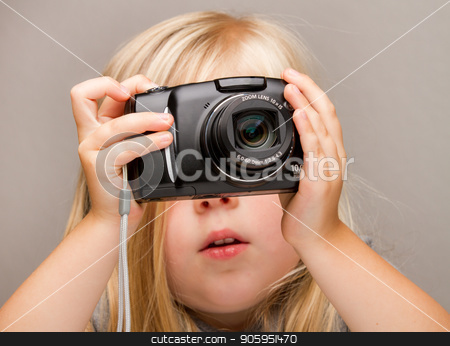 To use this stock image in your creative project, please select the size you need over to the right and click the "Add to Cart" button.
Your downloaded image will come with the Cutcaster watermark removed so don’t worry about the watermark you see on this page. Young child holding a camera taking a picture stock photo, Young child holding a point and shoot camera. Focus is on the camera as she is about to push the button by txking
