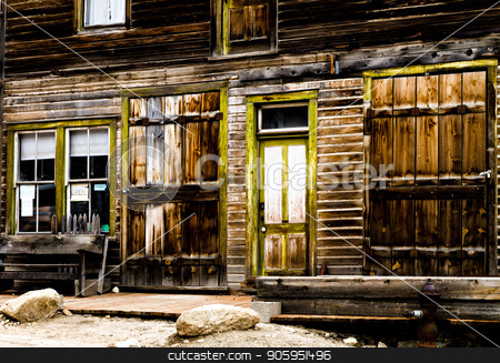 To use this stock image in your creative project, please select the size you need over to the right and click the "Add to Cart" button.
Your downloaded image will come with the Cutcaster watermark removed so don’t worry about the watermark you see on this page. Old store front from the wild west days stock photo, Wooden storefront of an old mining ghost town that is weathered. by txking