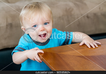 To use this stock image in your creative project, please select the size you need over to the right and click the "Add to Cart" button.
Your downloaded image will come with the Cutcaster watermark removed so don’t worry about the watermark you see on this page. Getting ready to turn the corner stock photo, A child at the end of the table getting ready to turn the corner as he is learning how to walk. by txking
