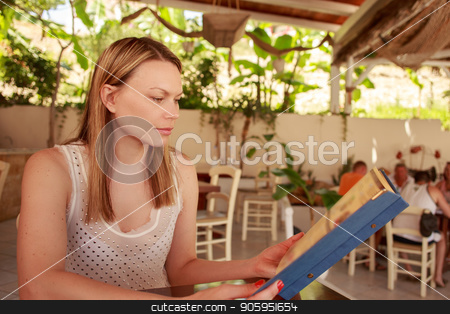 To use this stock image in your creative project, please select the size you need over to the right and click the "Add to Cart" button.
Your downloaded image will come with the Cutcaster watermark removed so don’t worry about the watermark you see on this page. Happy woman in cafe with menu. Beautiful vacation woman in restaurant at dinner. stock photo, Happy woman in cafe with menu. Beautiful vacation woman in restaurant at dinner. Greece, Bali. by Alfira Poyarkova