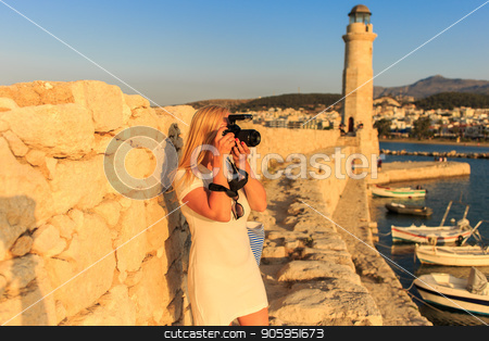 To use this stock image in your creative project, please select the size you need over to the right and click the "Add to Cart" button.
Your downloaded image will come with the Cutcaster watermark removed so don’t worry about the watermark you see on this page. Traveler woman photographer with professional camera takes shot of Rethymno,Crete, Greece. stock photo, Traveler woman photographer with professional camera takes shot of Rethymno,Crete, Greece. Caucasian female photographing outdoors. Europe travel concept. by Alfira Poyarkova