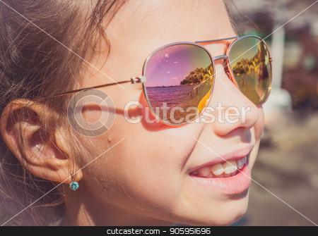 To use this stock image in your creative project, please select the size you need over to the right and click the "Add to Cart" button.
Your downloaded image will come with the Cutcaster watermark removed so don’t worry about the watermark you see on this page. Beautiful young girl in sunglasses with beach reflection. stock photo, Beautiful young girl in sunglasses with beach reflection. Holidays, travel, vacation and happiness concept. by Alfira Poyarkova
