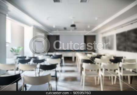 To use this stock image in your creative project, please select the size you need over to the right and click the "Add to Cart" button.
Your downloaded image will come with the Cutcaster watermark removed so don’t worry about the watermark you see on this page. Modern conference hall stock photo, Blurred photo of a conference hall with white walls and a gray floor. There are many light and dark chairs, board, projector, tables, lamps, plant in a pot. Horizontal. by bezikus