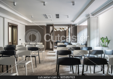 To use this stock image in your creative project, please select the size you need over to the right and click the "Add to Cart" button.
Your downloaded image will come with the Cutcaster watermark removed so don’t worry about the watermark you see on this page. Modern conference hall stock photo, Stylish conference hall with white walls and a gray floor. There are many light and dark chairs, table with soft chairs, lamps, plant in a pot, doors, lockers, columns. Horizontal. by bezikus