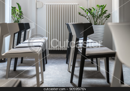 To use this stock image in your creative project, please select the size you need over to the right and click the "Add to Cart" button.
Your downloaded image will come with the Cutcaster watermark removed so don’t worry about the watermark you see on this page. Modern conference hall stock photo, Rows of black and white chairs in the conference room with white walls and a gray floor. There are green plants in the pots behind them. Closeup horizontal photo. by bezikus