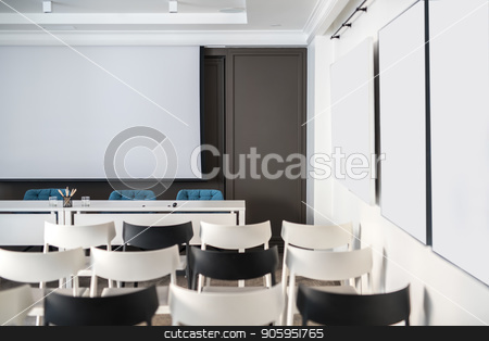 To use this stock image in your creative project, please select the size you need over to the right and click the "Add to Cart" button.
Your downloaded image will come with the Cutcaster watermark removed so don’t worry about the watermark you see on this page. Modern conference hall stock photo, Comfortable conference hall with white walls. There are many light and dark chairs, board, tables with blue soft chairs, lamps. Horizontal. by bezikus